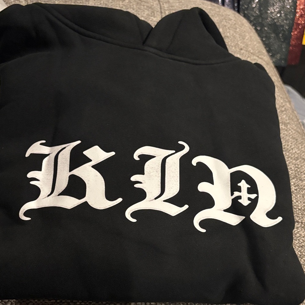 K I N Black Hoodie with White Gothic logo lettering
